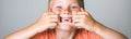 Funny child boy with missing front tooth on white background. Kid making funny faces showing teeth and missing milk Royalty Free Stock Photo