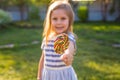 Funny child with candy lollipop, happy little girl eating big sugar lollipop, kid eat sweets Royalty Free Stock Photo