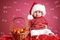 Funny Child in a Christmas red cap
