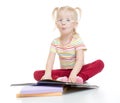Funny child in eyeglases reading book isolated