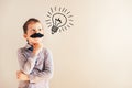 Funny child with fake mustache gesturing like an adult man, maturity and business concept Royalty Free Stock Photo