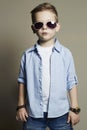 Funny child.fashionable little boy in sunglasses. jeans Royalty Free Stock Photo