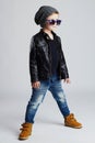 Funny child.fashionable little boy in sunglasses.stylish kid in yellow shoes Royalty Free Stock Photo