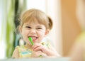 Funny child girl brushing teeth Royalty Free Stock Photo