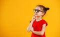 Funny child girl in glasses on colored background Royalty Free Stock Photo