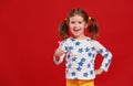 Funny child girl in glasses on colored background Royalty Free Stock Photo