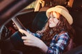 funny child girl playing driver, sitting on front seat