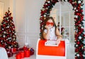 Funny Child Girl Sends A Letter To Santa Claus. Preparing For Christmas And Ordering Gifts From Santa