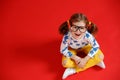Funny child girl in glasses on colored background Royalty Free Stock Photo