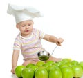 Funny child with green apples healthy food