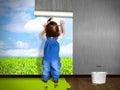 Funny child hanging wallpaper, doing repairs.