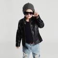 Funny child in hat.fashionable little boy in sunglasses.stylish kid in leather Royalty Free Stock Photo