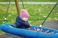 Funny child having fun with modern swing Royalty Free Stock Photo