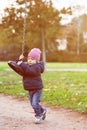 Funny child having fun with modern swing Royalty Free Stock Photo
