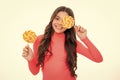 Funny child with lollipop over white isolated background. Sweet childhood life. Teen girl with yummy caramel lollipop