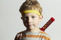 Funny child play ninja.Little Boy with ninja sword.Masquerade.Unusual