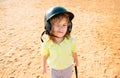 Funny child playing Baseball, winking. Batter in youth league getting a hit. Boy kid hitting a baseball. Royalty Free Stock Photo