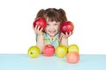 Funny child playing with two red apples Royalty Free Stock Photo