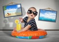 Funny child rest on swimming ring at home, as on the beach. Vacation creative concept Royalty Free Stock Photo