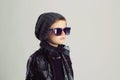 Funny child in scarf and hat.fashionable little boy in sunglasses Royalty Free Stock Photo