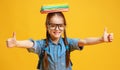 Funny child school girl girl on yellow background Royalty Free Stock Photo