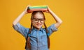 Funny child school girl girl on yellow background Royalty Free Stock Photo