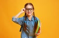 Funny child school girl girl on yellow background