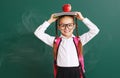 Funny child   schoolgirl girl student about school blackboard Royalty Free Stock Photo