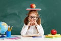 Funny child   schoolgirl  girl student about school blackboard Royalty Free Stock Photo