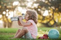 Funny child sport. Drinking water concept. Kid boy with bottle of water. Kid with drink water in park. Children