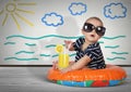 Funny child on swimming ring at home. Beach rest creative concept Royalty Free Stock Photo