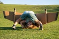 Funny child upside down on grass. Childhood imagination, kid dream to adventure travel. Travel and vacation with