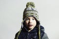 Funny child.winter fashion kids.fashionable little boy in winter color cap Royalty Free Stock Photo