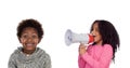 Funny childr shouting through a megaphone to his brother Royalty Free Stock Photo