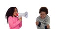 Funny childr shouting through a megaphone to his brother Royalty Free Stock Photo