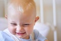 Funny, children and baby in the crib of a nursery in his home for growth, child development or curiosity. Kids, laughing Royalty Free Stock Photo