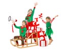 Funny Christmas Kids with Megaphone preparing New Year Gifts. Santa Claus Helpers, Cute Little Elves on Sleigh packing Christmas