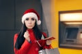 Funny Christmas Woman Holding a Coin Royalty Free Stock Photo