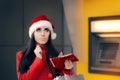 Funny Christmas Woman Holding a Coin Royalty Free Stock Photo