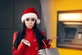 Funny Christmas Woman Holding a Coin Royalty Free Stock Photo