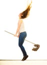 Funny cleaning woman with mop flying Royalty Free Stock Photo