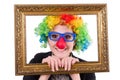 Funny clown girl with frame isolated Royalty Free Stock Photo