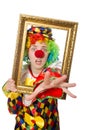 Funny clown girl with frame isolated on white Royalty Free Stock Photo