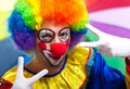 Funny clown posing on a colorful background Royalty Free Stock Photo