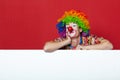 Funny clown with tie on blank board Royalty Free Stock Photo