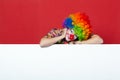 Funny clown with tie on blank board Royalty Free Stock Photo
