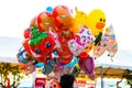 Funny colored balloons in the form of cartoon characters. Joy for the baby