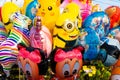 Funny colored balloons in the form of cartoon characters. Joy for the baby