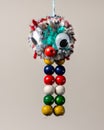 Funny colorful abstract animal made of wool and beads by a child