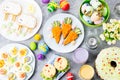 Funny colorful Easter food for kids with decorations on table. Easter dinner concept Royalty Free Stock Photo